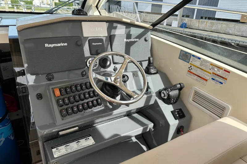 Slide: The Image of 2014 Pursuit SC 365i Sport Coupe helm with Raymarine electronics and Yamaha controls. - 16