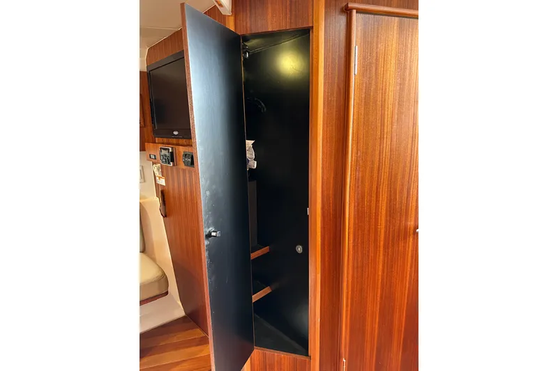 Slide: The Image of Interior of 2014 Pursuit SC 365i Sport Coupe with open wooden cabinet. - 24