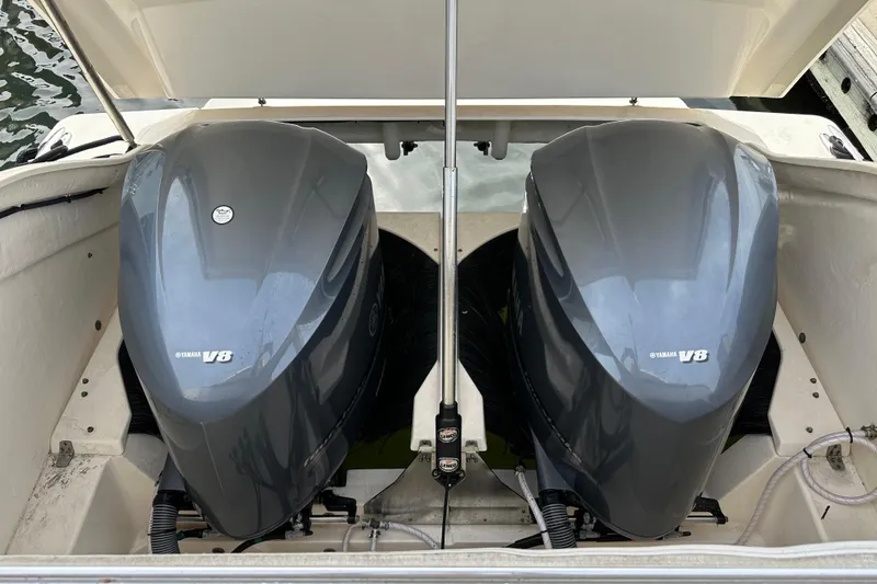 Slide: The Image of Twin Yamaha V8 engines on a 2014 Pursuit SC 365i Sport Coupe boat. - 7