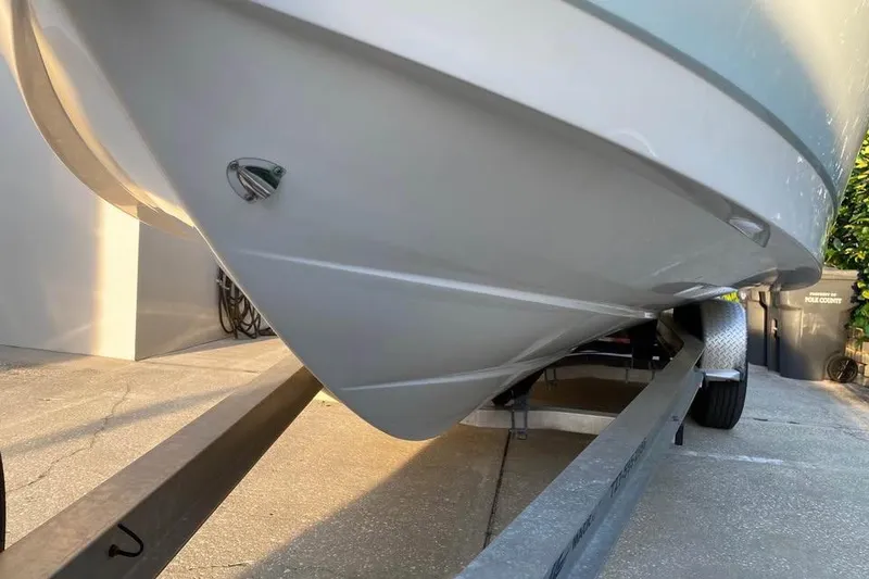 Slide: The Image of 2015 Robalo R247 Dual Console boat on trailer, side view. - 2