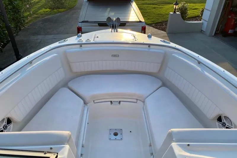 Slide: The Image of 2015 Robalo R247 Dual Console boat with spacious seating and sleek design. - 5