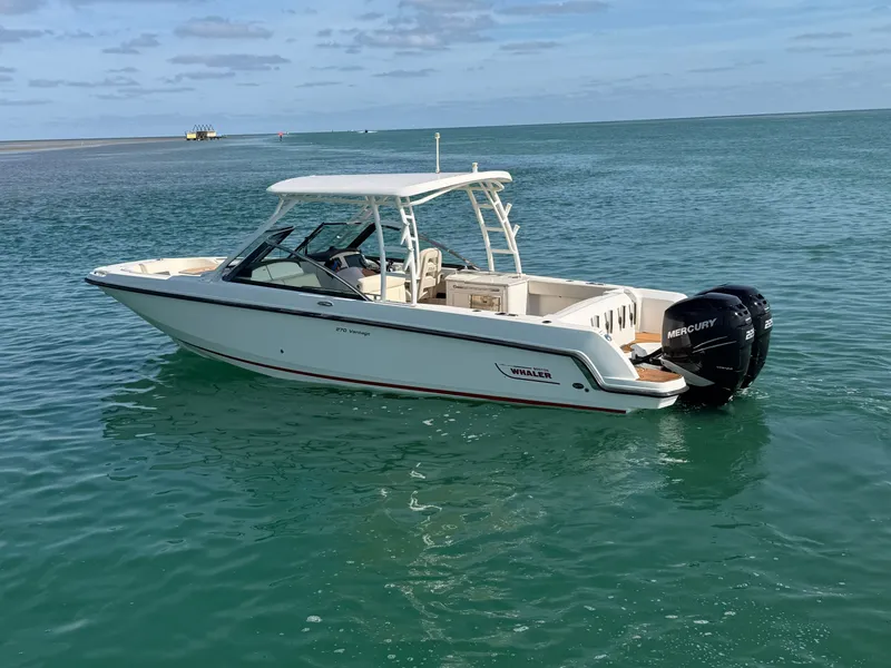 Slide: The Image of 2016 Boston Whaler 270 Vantage boat on calm water. - 4