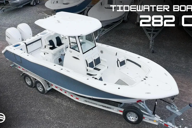 The Image of 2026 Tidewater 282 CC Adventure boat on trailer, featuring dual engines and spacious deck. - 0