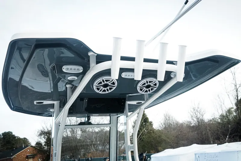 Slide: The Image of Tidewater 282 CC Adventure 2026 boat with rod holders and speakers on the T-top. - 10