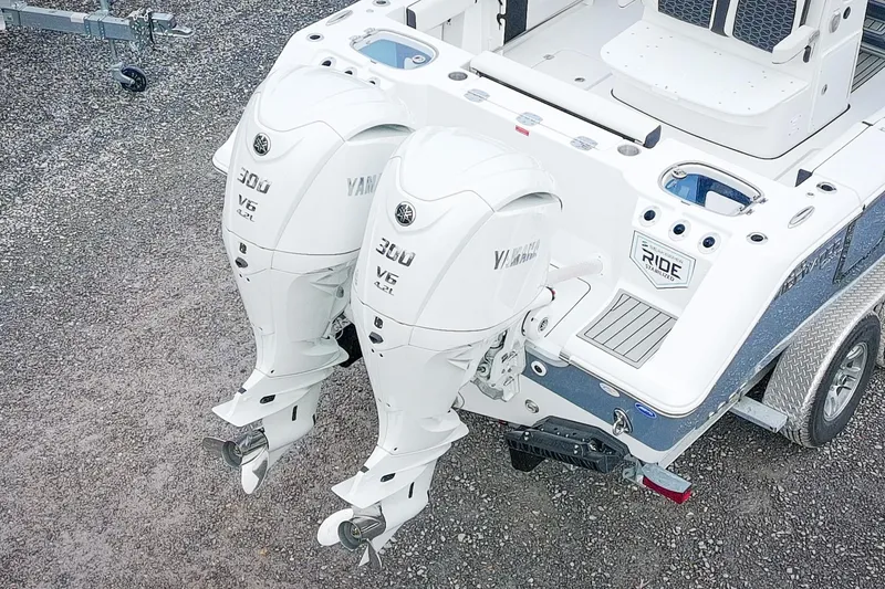 Slide: The Image of 2026 Tidewater 282 CC Adventure boat with dual Yamaha 300 V6 engines. - 11