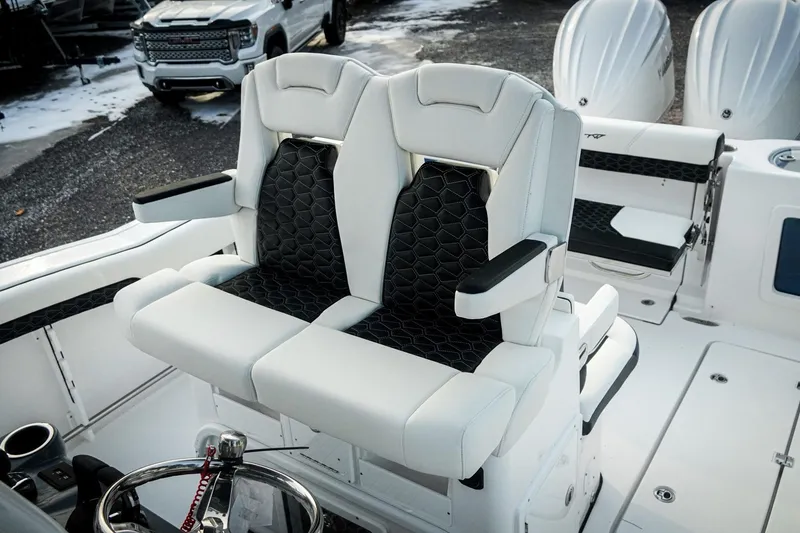Slide: The Image of 2026 Tidewater 282 CC Adventure boat interior with luxurious seating and modern design. - 17