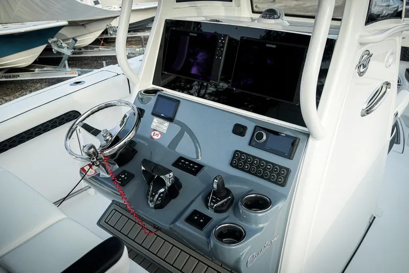 Slide: The Image of Control panel of 2026 Tidewater 282 CC Adventure boat with modern navigation equipment. - 18