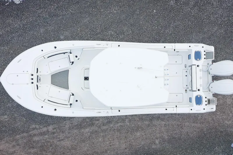 Slide: The Image of Overhead view of 2026 Tidewater 282 CC Adventure boat on gravel surface. - 2