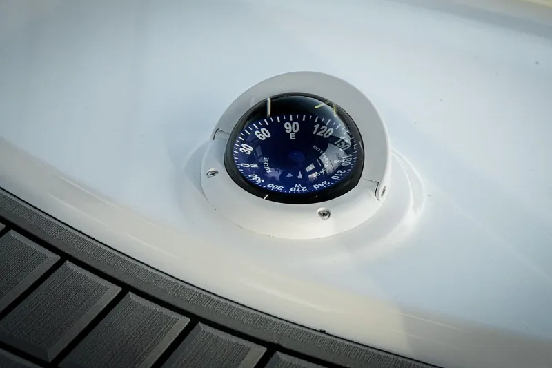 Slide: The Image of Compass on 2026 Tidewater 282 CC Adventure boat dashboard. - 25