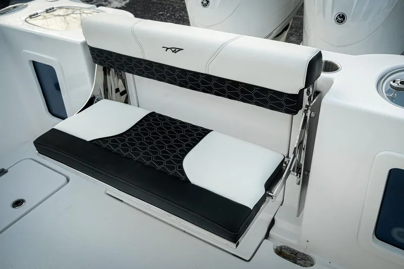 Slide: The Image of 2026 Tidewater 282 CC Adventure boat seat with black and white upholstery. - 28