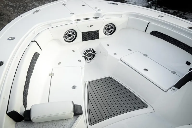 Slide: The Image of 2026 Tidewater 282 CC Adventure boat interior with seating and speakers. - 38