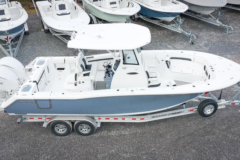 Slide: The Image of 2026 Tidewater 282 CC Adventure boat on trailer, aerial view. - 4