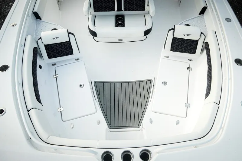 Slide: The Image of 2026 Tidewater 282 CC Adventure boat interior with cushioned seating and storage compartments. - 41