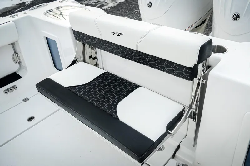 Slide: The Image of 2026 Tidewater 282 CC Adventure boat seat with black and white upholstery design. - 52
