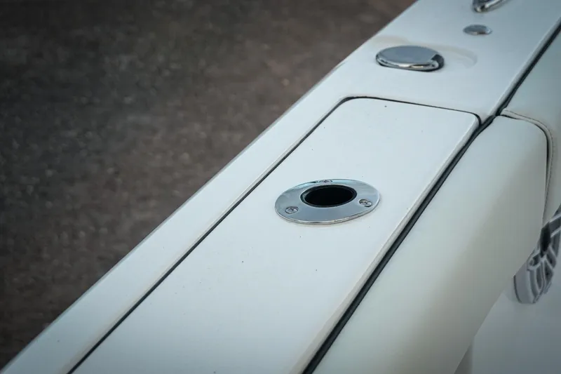 Slide: The Image of 2026 Tidewater 282 CC Adventure boat detail, featuring sleek white deck design. - 60