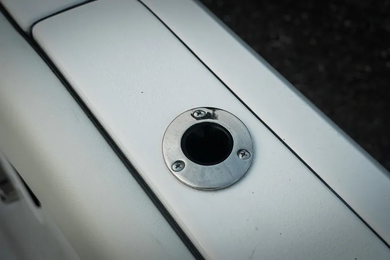 Slide: The Image of Close-up of a 2026 Tidewater 282 CC Adventure boat rod holder. - 61