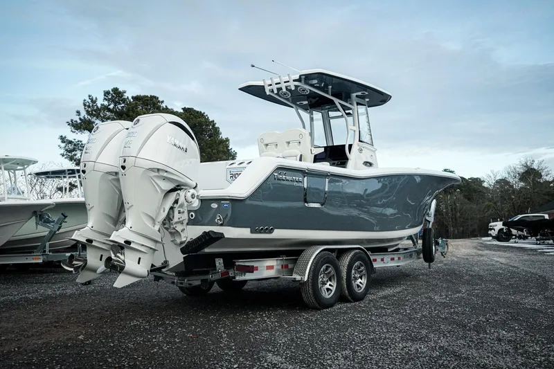 Slide: The Image of 2026 Tidewater 282 CC Adventure boat on trailer with dual Yamaha engines. - 7