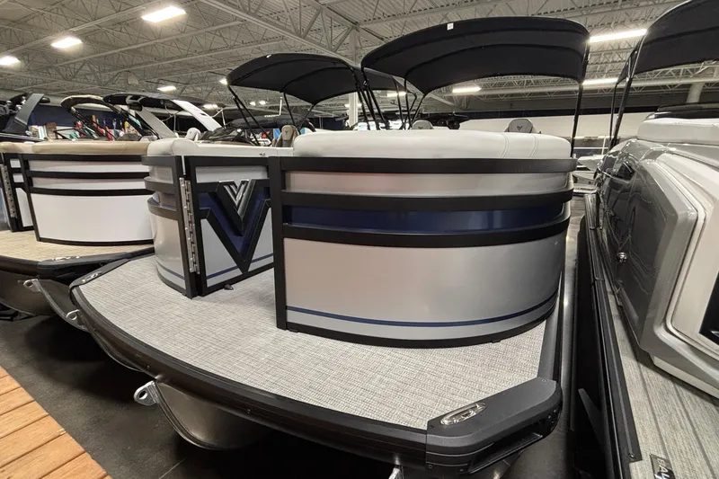 The Image of 2026 Viaggio Lago Z24U pontoon boat displayed in a showroom with sleek design. - 1