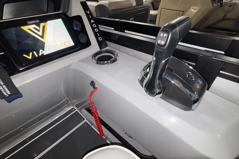 Slide: The Image of Control panel of 2026 Viaggio Lago Z24U boat with throttle and display screen. - 7