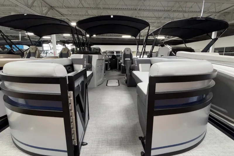 Slide: The Image of 2026 Viaggio Lago Z24U pontoon boat interior with plush seating and sleek design. - 16
