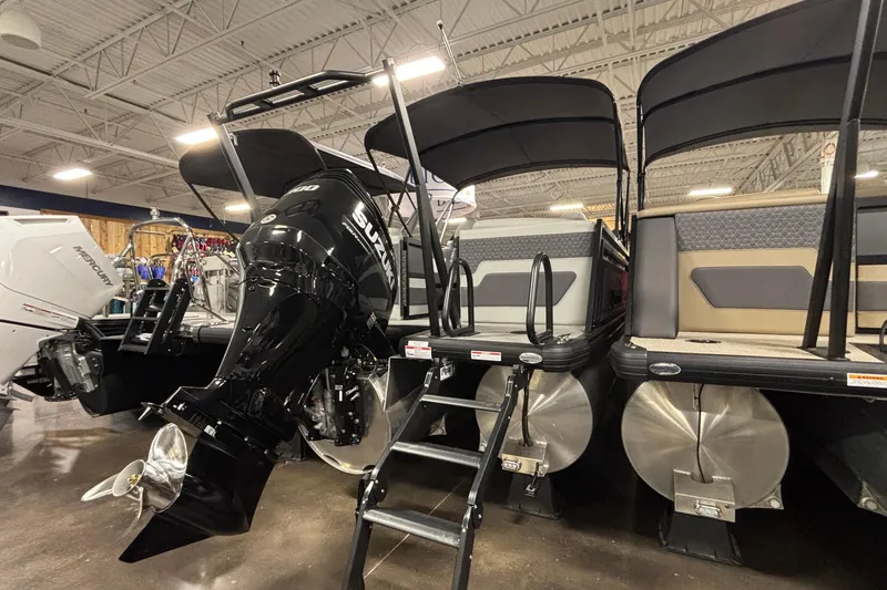 Slide: The Image of 2026 Viaggio Lago Z24U pontoon boat with Suzuki outboard motor in showroom. - 17