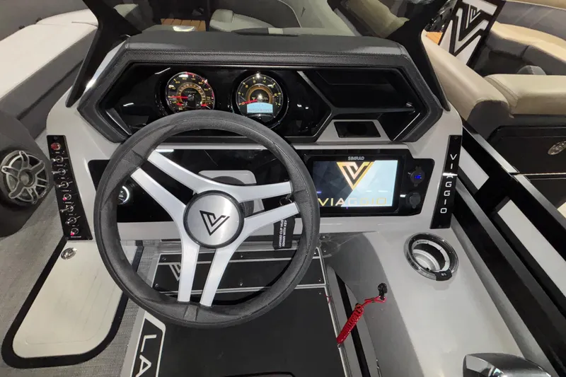 Slide: The Image of Interior of 2026 Viaggio Lago Z24U boat with modern dashboard and steering wheel. - 6