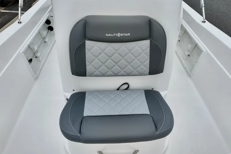 Slide: The Image of 2025 NauticStar 211 Hybrid boat seat with gray and white quilted upholstery. - 10