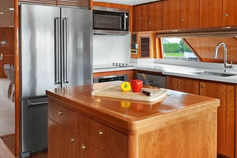 Slide: The Image of Luxurious kitchen in 2003 Hargrave Sky Lounge yacht with modern appliances and wooden cabinetry. - 14