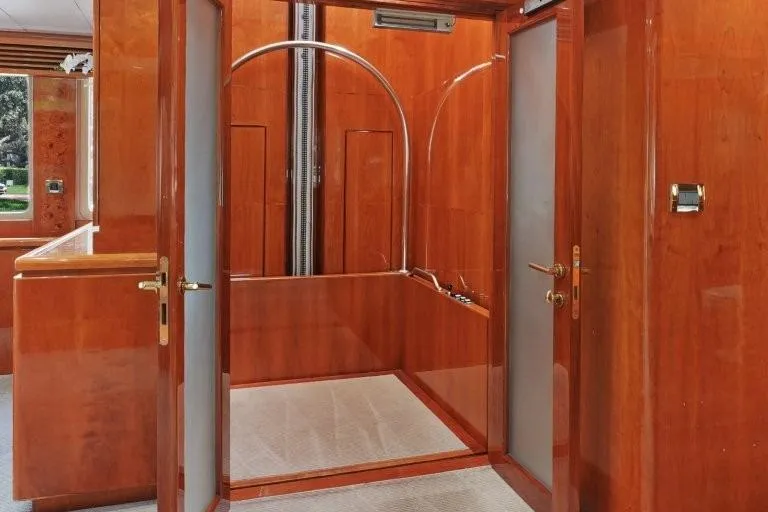 Slide: The Image of Luxurious wooden interior of 2003 Hargrave Sky Lounge yacht, featuring elegant design elements. - 26