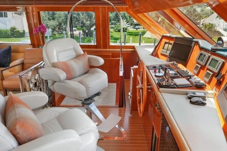 Slide: The Image of Luxurious 2003 Hargrave Sky Lounge yacht interior with plush seating and advanced navigation controls. - 38