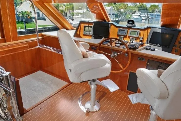 Slide: The Image of Luxurious 2003 Hargrave Sky Lounge yacht interior with helm, white chairs, and navigation equipment. - 39