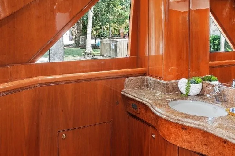 Slide: The Image of Luxurious wooden interior of 2003 Hargrave Sky Lounge yacht with elegant sink and countertop. - 48