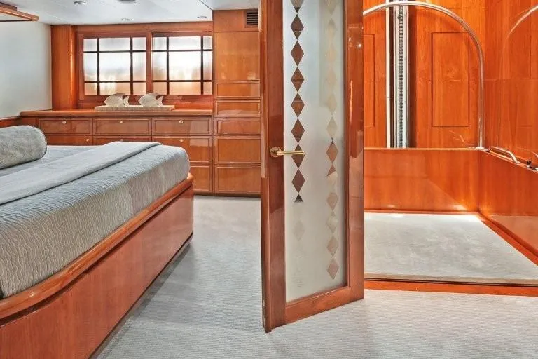 Slide: The Image of Luxurious 2003 Hargrave Sky Lounge yacht interior with elegant wood finishes and spacious bedroom. - 56