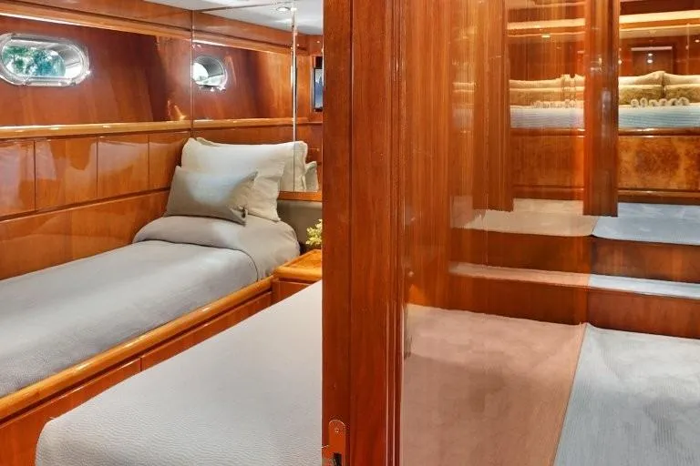 Slide: The Image of Luxurious 2003 Hargrave Sky Lounge yacht interior with elegant wood paneling and cozy twin beds. - 58