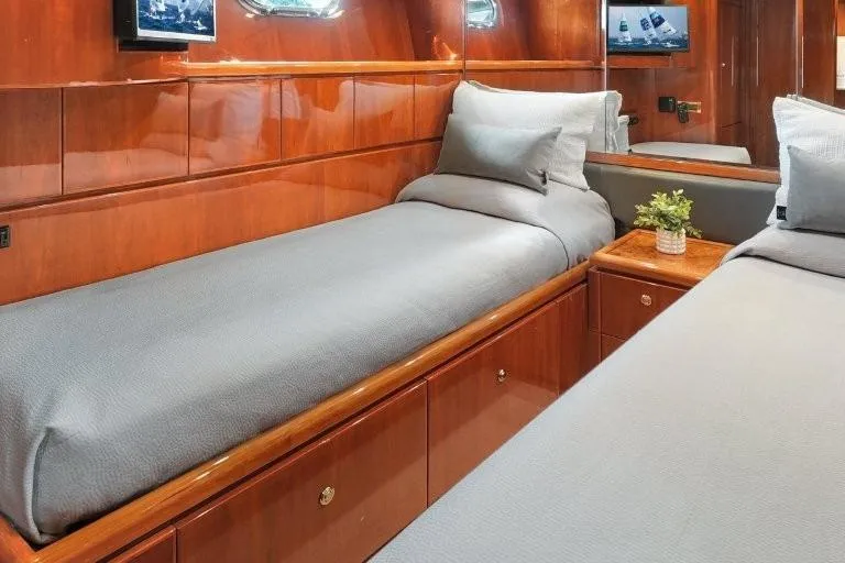 Slide: The Image of Luxurious 2003 Hargrave Sky Lounge yacht cabin with twin beds and elegant wood paneling. - 60