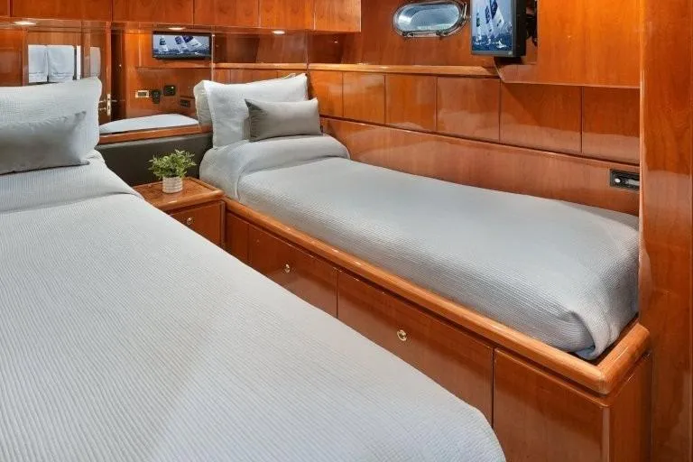 Slide: The Image of Luxurious twin cabin in 2003 Hargrave Sky Lounge yacht with wood paneling and modern amenities. - 61