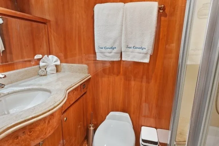 Slide: The Image of Luxurious 2003 Hargrave Sky Lounge yacht bathroom with elegant wood paneling and plush towels. - 65