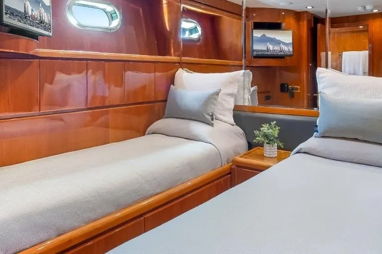 Slide: The Image of Luxurious 2003 Hargrave Sky Lounge yacht bedroom with elegant wood paneling and cozy bedding. - 66
