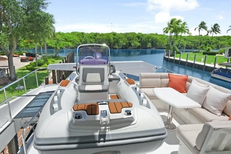 Slide: The Image of Luxurious 2003 Hargrave Sky Lounge yacht with elegant seating and scenic waterfront view. - 79