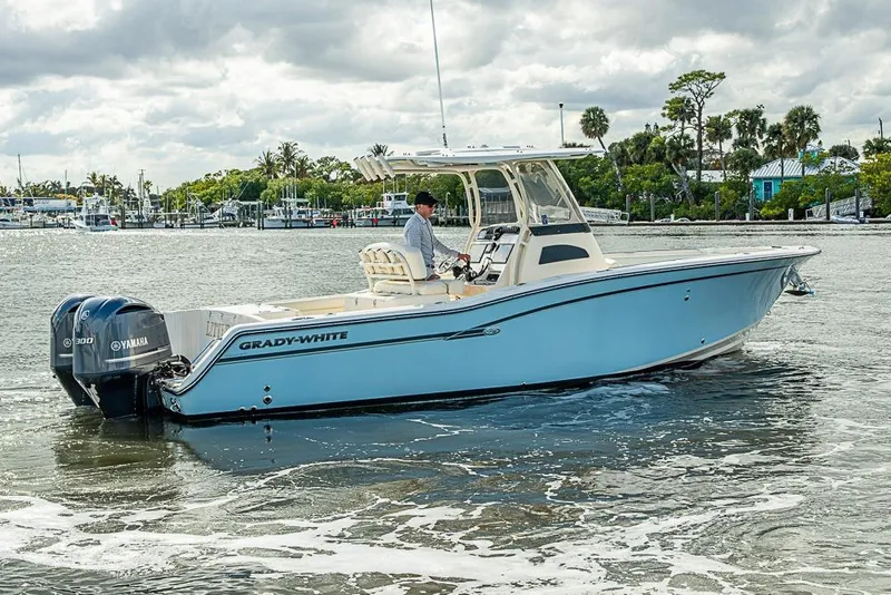Slide: The Image of 2016 Grady-White Canyon 271 FS boat on water with Yamaha engines. - 1