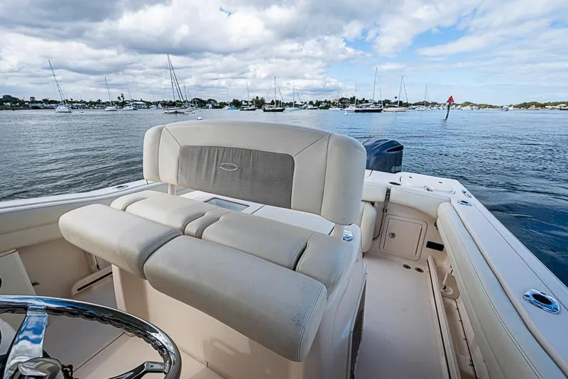 Slide: The Image of 2016 Grady-White Canyon 271 FS boat interior with scenic harbor view. - 10
