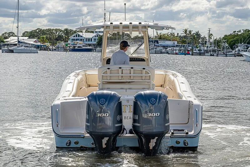 Slide: The Image of 2016 Grady-White Canyon 271 FS boat with dual Yamaha engines on the water. - 2