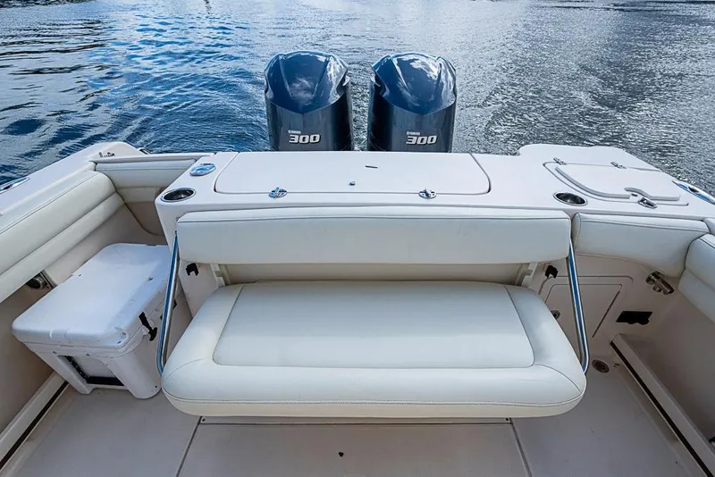 Slide: The Image of 2016 Grady-White Canyon 271 FS boat with dual Yamaha 300 engines, rear seating view. - 6