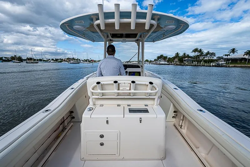 Slide: The Image of 2016 Grady-White Canyon 271 FS boat cruising on a scenic waterway. - 8