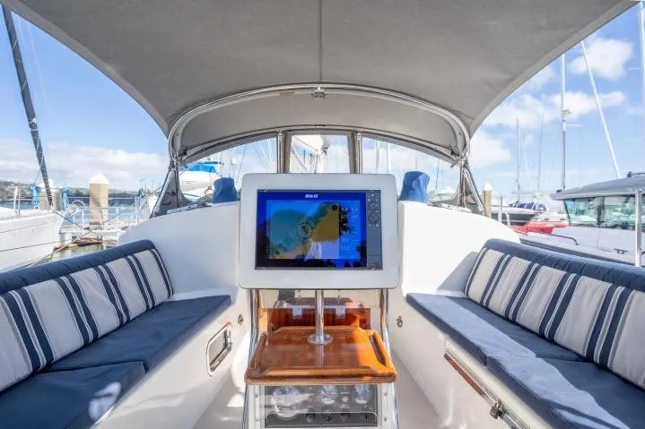 Slide: The Image of Luxurious 2015 Blue Jacket 40 yacht interior with navigation screen and striped seating. - 27