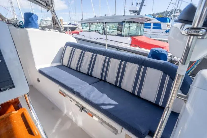 Slide: The Image of Blue Jacket 40 sailboat cockpit with striped cushions, docked in marina, 2015 model. - 29