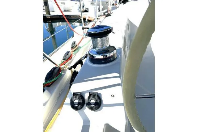 Slide: The Image of Sailboat deck of 2015 Blue Jacket 40 with winch and ropes at marina. - 31