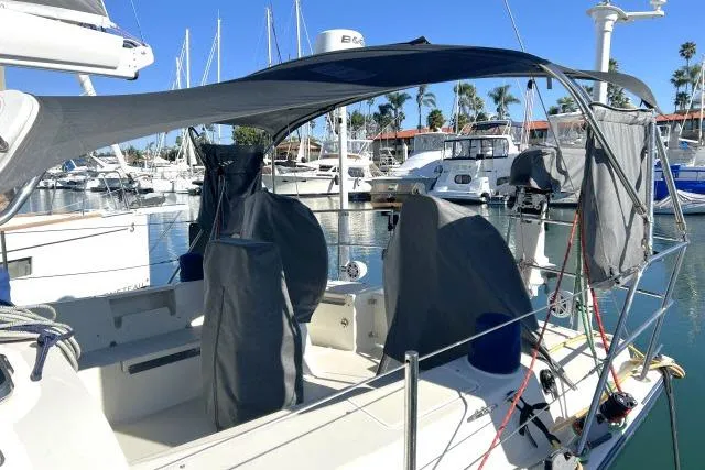 Slide: The Image of Sailboat Blue Jacket 40, 2015 model, docked in marina with protective covers. - 33