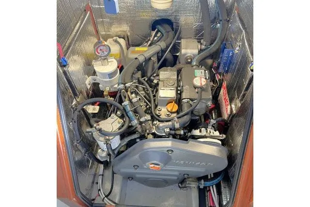 Slide: The Image of Engine compartment of a 2015 Blue Jacket 40 sailboat, showcasing detailed mechanical components. - 44