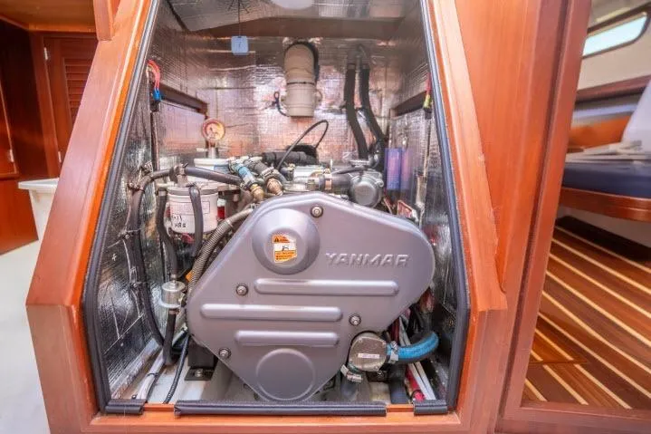 Slide: The Image of Engine compartment of a 2015 Blue Jacket 40 sailboat, featuring a Yanmar engine. - 47